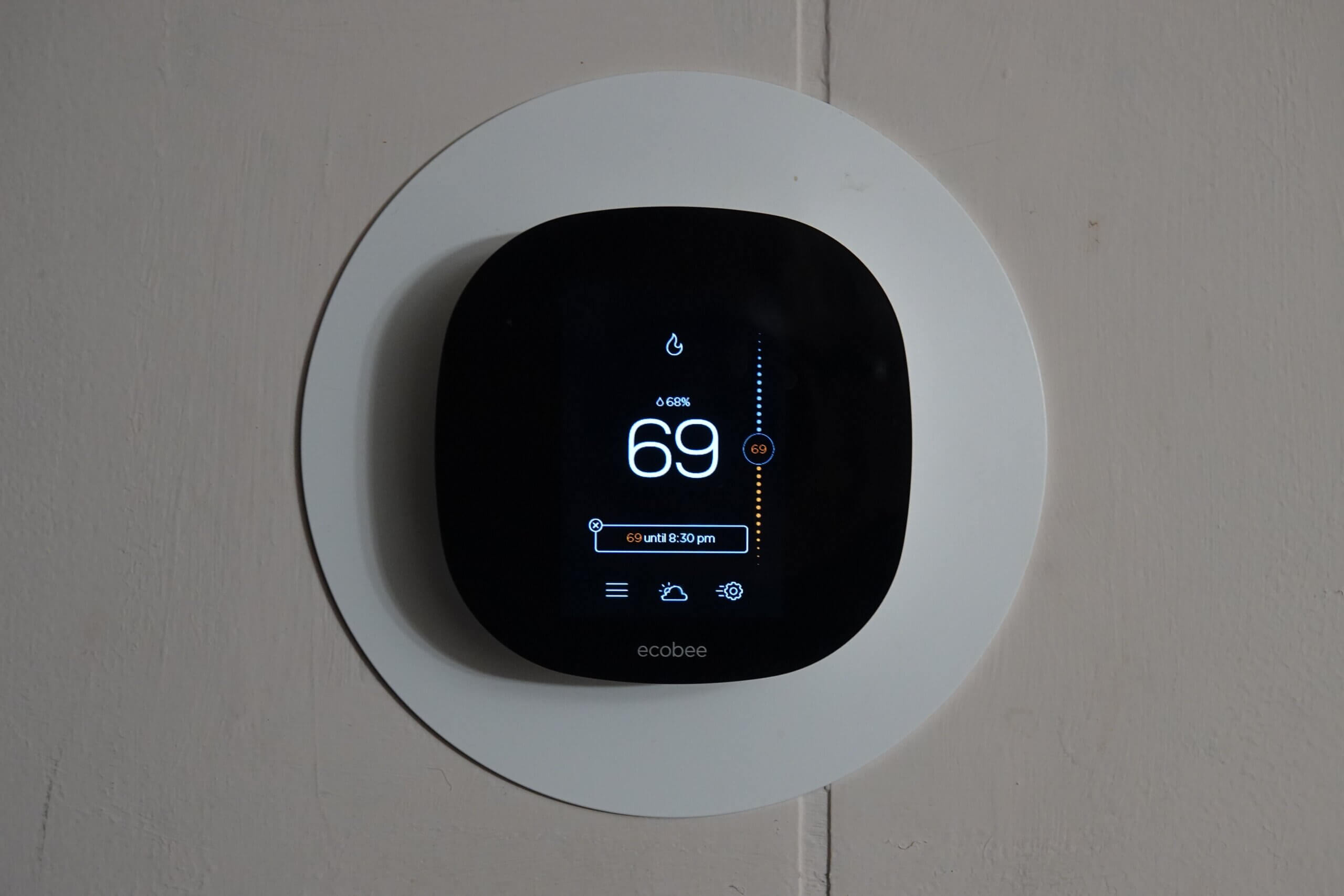 digital thermostat showing 69 degrees F
