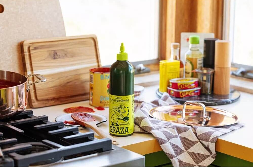 Graza "Drizzle" Extra Virgin Olive Oil on kitchen counter