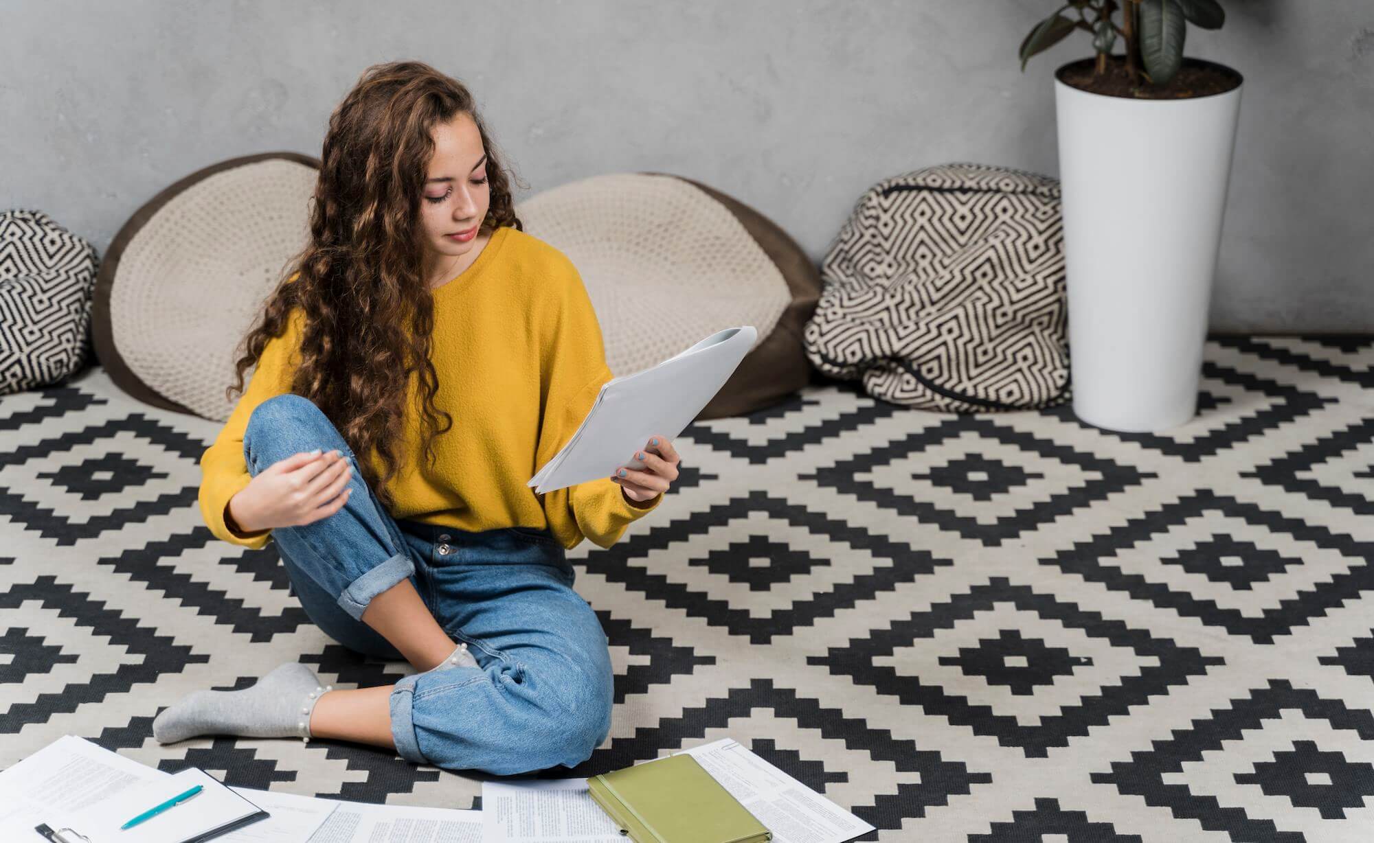 woman studying on cozy apartment area rug