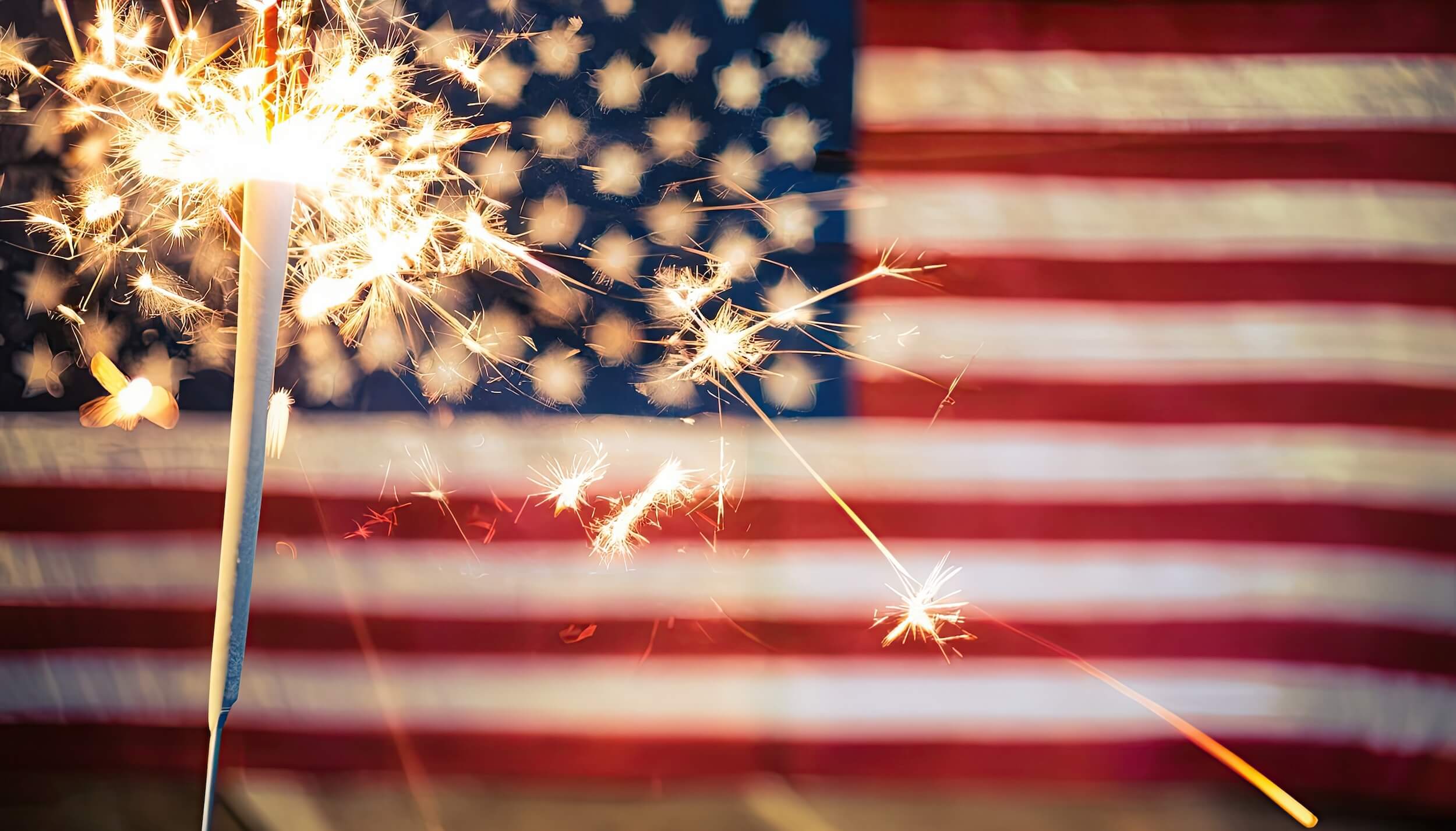 sparkler in front of American flag