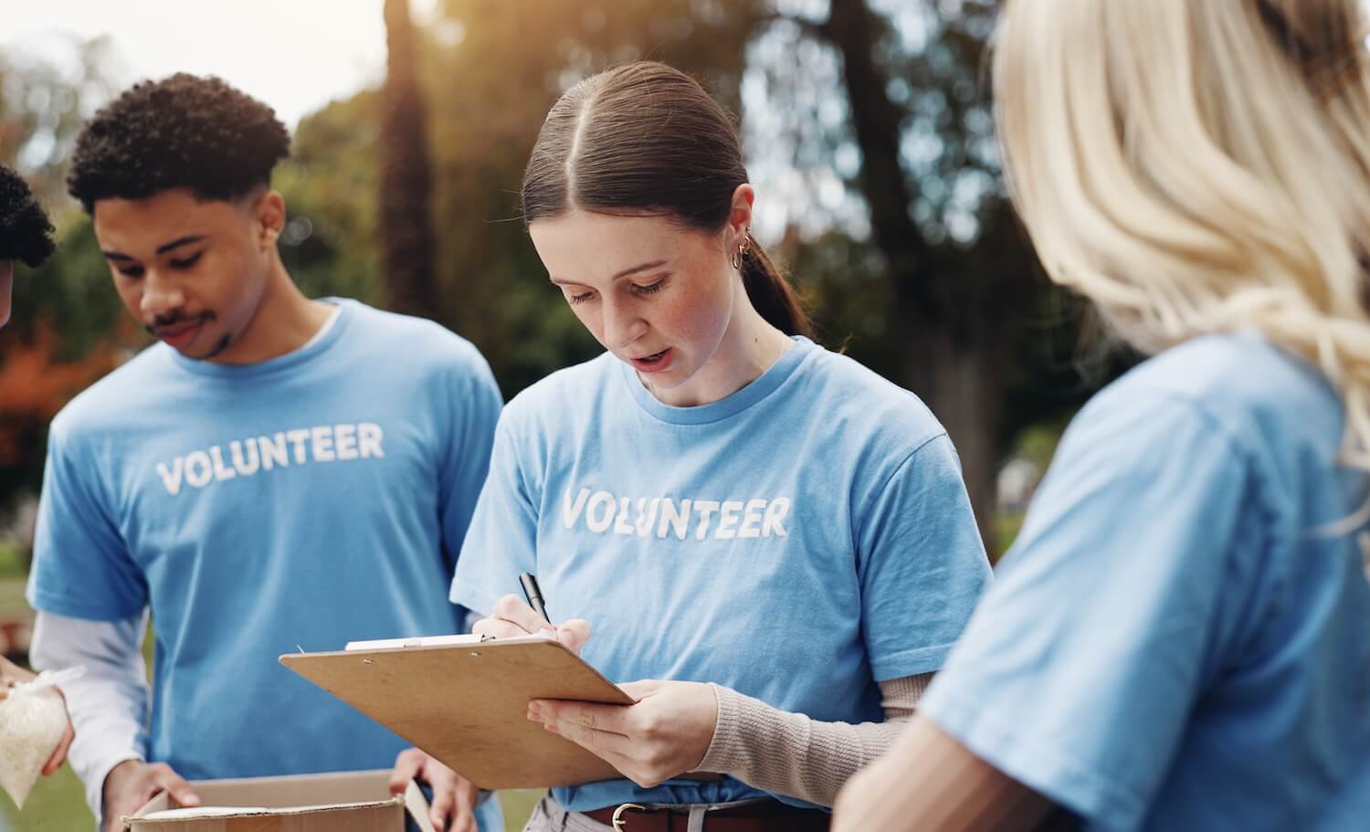 Checklist, volunteer and group of people in park together