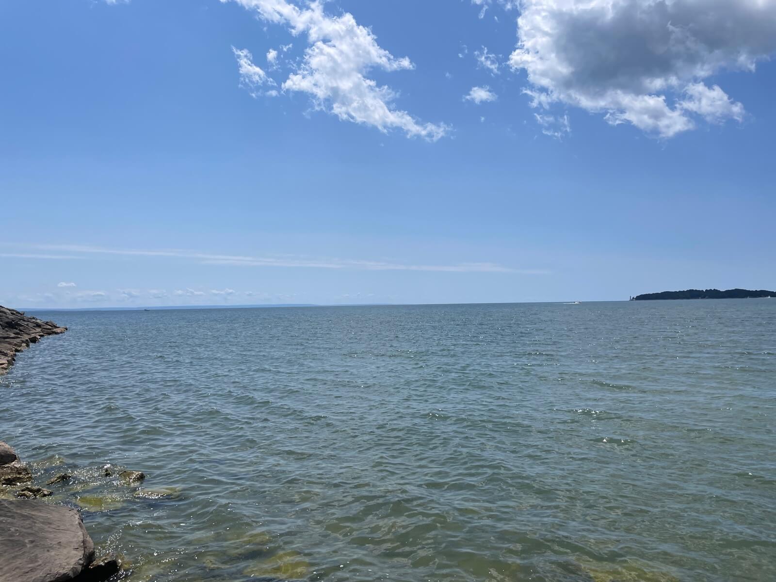The calm blue water of Lake Erie seen from the shoreline at Crystal Beach in Fort Erie, Ontario